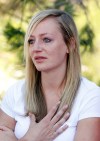 Amanda Lindgren cries as she speaks about her boyfriend Alex Teves, at the Arapahoe County Courthouse, Monday, July 23, 2012, in Centennial, Colo. Teves was one of the 12 people killed in the shooting attack early Friday at an Aurora, Colo., theater during a showing of the Batman movie, 