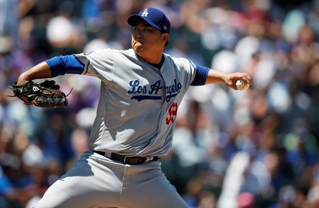 Los Angeles Dodgers starting pitcher Hyun-Jin Ryu works against the Colorado Rockies in the first inning of a baseball game Wednesday, July 31, 2019, in Denver. (AP Photo/David Zalubowski)