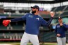 Atlanta Braves right fielder Nick Markakis warms up before facing the Colorado Rockies in a baseball game Monday, April 8, 2019, in Denver. (AP Photo/David Zalubowski)