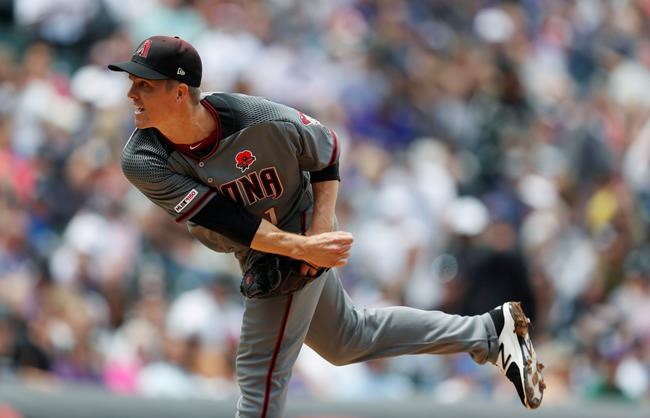 Arizona Diamondbacks starting pitcher Zack Greinke works against the Colorado Rockies in the first inning of a baseball game Monday, May 27, 2019, in Denver. (AP Photo/David Zalubowski)