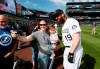 Colorado Rockies outfielder Charlie Blackmon, right, stops for a photo with Stephanie Archuleta, center, and her 20-month-old daughter Javielyn during a fan photo promotion before a baseball game against the Toronto Blue Jays, Saturday, June 1, 2019, in Denver. (AP Photo/David Zalubowski)