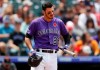 Colorado Rockies' Nolan Arenado checks his bat while facing Arizona Diamondbacks starting pitcher Zack Greinke in the first inning of a baseball game Monday, May 27, 2019, in Denver. (AP Photo/David Zalubowski)