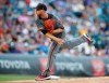 Arizona Diamondbacks starting pitcher Merrill Kelly works against the Colorado Rockies in the first inning of a baseball game Monday, Aug. 12, 2019, in Denver. (AP Photo/David Zalubowski)