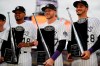 From left, Colorado Rockies starting pitcher German Marquez, Colorado Rockies shortstop Trevor Story and Colorado Rockies third baseman Nolan Arenado hold up their Silver Slugger awards during a ceremony before a baseball game against the Los Angeles Dodgers Saturday, April 6, 2019, in Denver. (AP Photo/David Zalubowski)