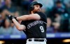 Colorado Rockies' Daniel Murphy follows the flight of his double to drive in two runs off Toronto Blue Jays starting pitcher Marcus Stroman in the first inning of a baseball game Saturday, June 1, 2019, in Denver. (AP Photo/David Zalubowski)