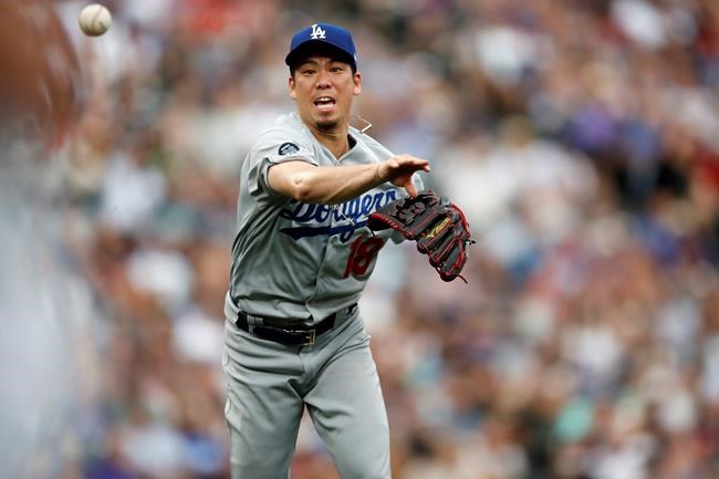 Los Angeles Dodgers starting pitcher Kenta Maeda throws to first base to put out Colorado Rockies' David Dahl to end the third inning of a baseball game Sunday, June 30, 2019, in Denver. (AP Photo/David Zalubowski)