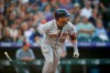 Houston Astros' Yuli Gurriel watches his single off Colorado Rockies starting pitcher Peter Lambert in the third inning of a baseball game Wednesday, July 3, 2019, in Denver. (AP Photo/David Zalubowski)