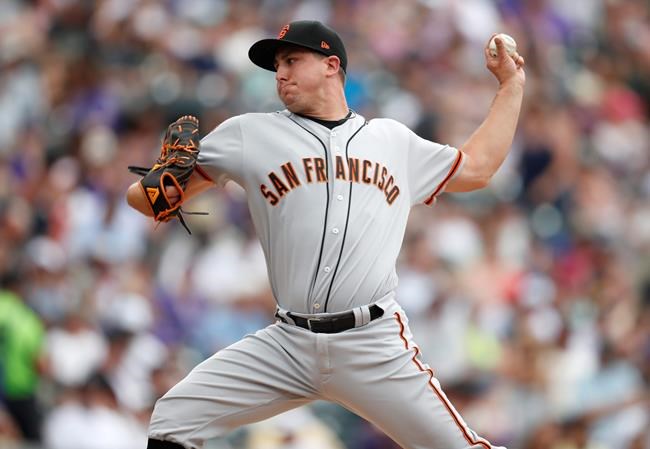 San Francisco Giants relief pitcher Derek Holland works against the Colorado Rockies in the fifth inning of a baseball game Wednesday, July 17, 2019, in Denver. (AP Photo/David Zalubowski)