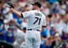 Colorado Rockies' Wade Davis waits for a new ball after giving up a three-run home run to Los Angeles Dodgers' Will Smith during the ninth inning of a baseball game Wednesday, July 31, 2019, in Denver. The Dodgers won 5-1. (AP Photo/David Zalubowski)