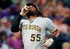 Pittsburgh Pirates' Josh Bell gestures as he crosses home plate after hitting a solo home run off Colorado Rockies relief pitcher Wes Parsons in the fourth inning of a baseball game, Saturday, Aug. 31, 2019, in Denver. (AP Photo/David Zalubowski)