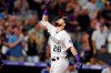 Colorado Rockies' David Dahl gestures as he crosses home plate after hitting a two-run home run off Los Angeles Dodgers starting pitcher Hyun-Jin Ryu in the fifth inning of a baseball game Friday, June 28, 2019, in Denver. (AP Photo/David Zalubowski)