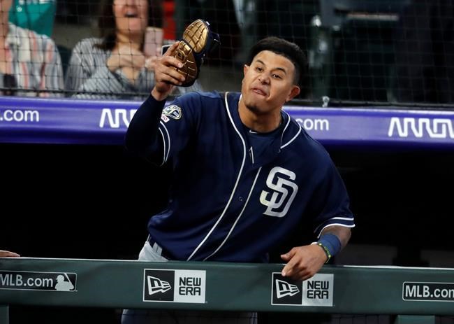 San Diego Padres' Manny Machado yells at home plate umpire Bill Welke, who had called Machado out on strikes during the fifth inning of the team's baseball game against the Colorado Rockies on Saturday, June 15, 2019, in Denver. (AP Photo/David Zalubowski)