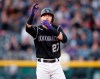 Colorado Rockies' Trevor Story gestures to the dugout after hitting a double to drive in three runs off Toronto Blue Jays starting pitcher Edwin Jackson in the third inning of a baseball game Friday, May 31, 2019, in Denver. (AP Photo/David Zalubowski)