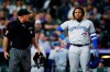 Home plate umpire Brian O'Nora, left, talks with Toronto Blue Jays' Vladimir Guerrero Jr. after Guerrero was called out on strikes to end the top of the eighth inning of a baseball game against the Colorado Rockiesm Saturday, June 1, 2019, in Denver. (AP Photo/David Zalubowski)