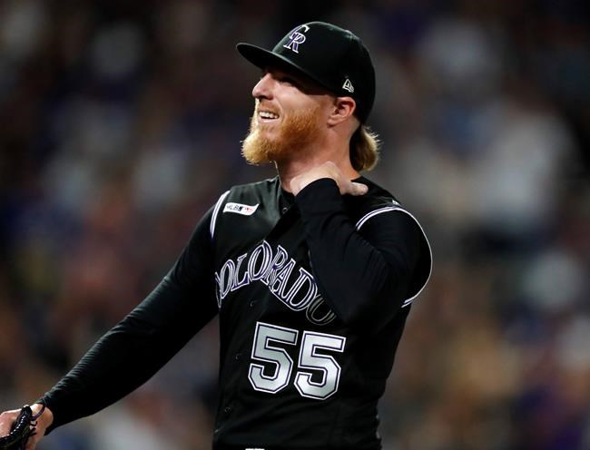 Colorado Rockies starting pitcher Jon Gray reacts after striking out Los Angeles Dodgers' Max Muncy to end the top of the eighth inning of a baseball game Monday, July 29, 2019, in Denver. (AP Photo/David Zalubowski)