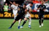 Mexico defender Diego Reyes, left, fights for control of the ball with Canada forward Lucas Cavallini during the first half of a CONCACAF Gold Cup soccer match Wednesday, June 19, 2019, it Mile High Stadium in Denver. (AP Photo/David Zalubowski)