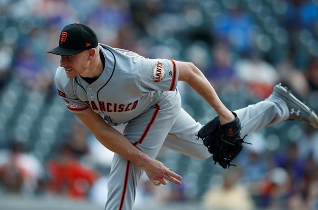 San Francisco Giants relief pitcher Mark Melancon works against the Colorado Rockies in the ninth inning of a baseball game Wednesday, July 17, 2019, in Denver. The Giants won 11-8 to sweep the four-game series. (AP Photo/David Zalubowski)