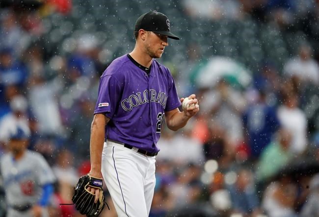 Colorado Rockies starting pitcher Kyle Freeland reacts after giving up a solo home run to Los Angeles Dodgers' A.J. Pollock in the first inning of a baseball game Tuesday, July 30, 2019, in Denver. (AP Photo/David Zalubowski)