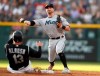 Miami Marlins third baseman Jon Berti, back, throws to first base after forcing out Colorado Rockies' Yonder Alonso at second base on a ground ball hit by Raimel Tapia, who was safe at first during the second inning of a baseball game Friday, Aug. 16, 2019, in Denver. (AP Photo/David Zalubowski)