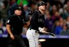 Colorado Rockies' Trevor Story, right, watches the flight of his solo walkoff home run off Milwaukee Brewers relief pitcher Matt Albers in the 10th inning of a baseball game Saturday, Sept. 28, 2019, in Denver. (AP Photo/David Zalubowski)