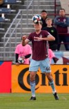 Colorado Rapids defender Axel Sjoberg heads the ball during the first half of the team's MLS soccer match against the Vancouver Whitecaps on Friday, May 3, 2019, in Commerce City, Colo. (AP Photo/Jack Dempsey)