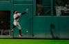 San Francisco Giants center fielder Kevin Pillar misses a fly ball hit off the bat of Colorado Rockies' Ian Desmond for an RBI-triple during the fourth inning of a baseball game, Tuesday, May 7, 2019, in Denver. (AP Photo/Jack Dempsey)