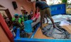 Dead bodies of blast victims are removed from St. Sebastian's Church in Negombo, north of Colombo, Sri Lanka, Sunday, April 21, 2019. More than hundred were killed and hundreds more hospitalized with injuries from eight blasts that rocked churches and hotels in and just outside of Sri Lanka's capital on Easter Sunday, officials said, the worst violence to hit the South Asian country since its civil war ended a decade ago. (AP Photo/Chamila Karunarathne)