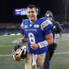 THE CANADIAN PRESS/John Woods
Winnipeg Blue Bombers quarterback Zach Collaros runs off the field after defeating the Calgary Stampeders in CFL action in Winnipeg Friday.