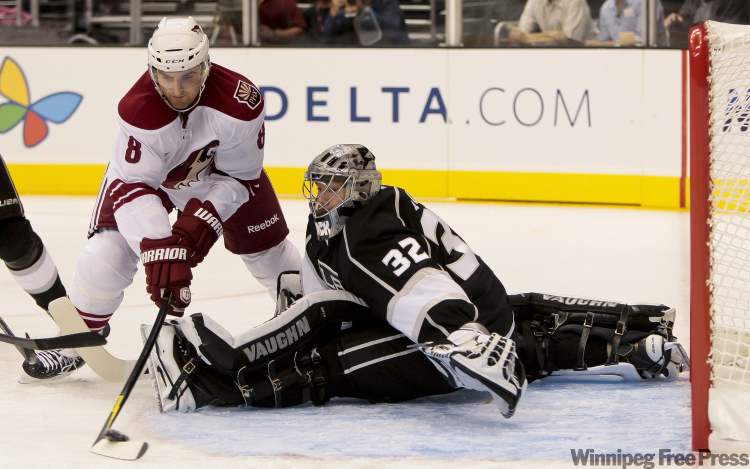 Bret Hartman/ The Associated Press
Phoenix Coyotes left wing Brett MacLean attempts a shot on Los Angeles Kings goalie Jonathan Quick during the first period of an NHL preseason hockey game, Wednesday, Sept. 21, 2011, in Los Angeles.
