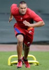 Philadelphia Philllies' Tyson Gillies runs, pulling a weighted sled during practice before the start of baseball spring training, Saturday, Feb. 18, 2012, in Clearwater, Fla. Ask the Toronto Blue Jays' Brett Lawrie who he thinks Canada's breakout player will be at the World Baseball Classic and he'll say it's Gillies.THE CANADIAN PRESS/AP-Matt Slocum