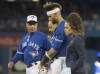Toronto Blue Jays' Lourdes Gurriel Jr. is helped off the field after he hit the ground awkwardly at first base during ninth inning American League MLB baseball game action against the New York Yankees in Toronto Thursday August 8, 2019. Gurriel Jr., was reinstated from the 10-day injured list by the Toronto Blue Jays on Saturday afternoon. THE CANADIAN PRESS/Fred Thornhill