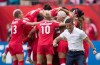 Canada coach John Herdman, right, celebrates as Josee Belanger, back, is mobbed by her teammates after scoring against Switzerland during the second half of the FIFA Women's World Cup round of 16 soccer action in Vancouver, B.C., on Sunday, June 21, 2015. As the Women's World Cup wound down, Herdman pointed to his team's very first game when asked about his favourite memories from the tournament. THE CANADIAN PRESS/Darryl Dyck