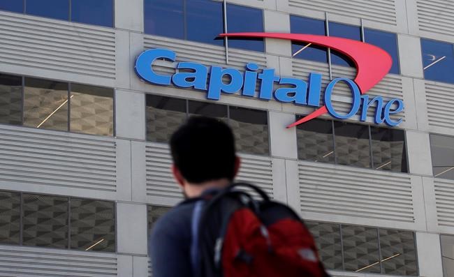 A man walks across the street from a Capital One location in San Francisco on July 16, 2019. A hacker gained access to personal information from more than 100 million Capital One credit applications, including six million from Canada, the bank said Monday as federal authorities arrested a suspect in the case. THE CANADIAN PRESS/AP, Jeff Chiu