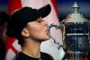 Bianca Andreescu, of Canada, kisses the championship trophy after defeating Serena Williams, of the United States, during the women's singles final of the U.S. Open tennis championships Saturday, Sept. 7, 2019, in New York. Andreescu began her day Saturday the same way she started every morning during her run to the U.S. Open title. By meditating and visualizing how she could beat her next opponent. THE CANADIAN PRESS/AP-Charles Krupa