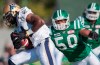 Winnipeg Blue Bombers wide receiver Cory Watson breaks a tackle from Saskatchewan Roughriders linebacker Jerrell Freeman in the third quarter of CFL football action at Mosaic Stadium on Sunday, Sept. 4, 2011 in Regina. Freeman has always been on the ball on the football field, but his quick thinking Sunday saved a man's life. THE CANADIAN PRESS/Liam Richards