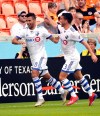 Montreal Impact's Saphir Taider (8) celebrates with Daniel Lovitz (3) after scoring a goal against the Houston Dynamo during the first half of an MLS soccer match Saturday, March 9, 2019, in Houston. Impact midfielder Taider will play in two games for the Algerian national team.THE CANADIAN PRESS/AP/David J. Phillip