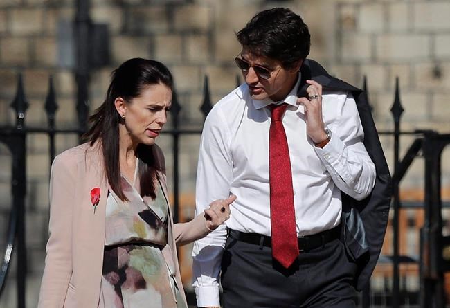 The Prime Minister of New Zealand Jacinda Ardern, left, talks to the Canadian Prime Minister Justin Trudeau as they arrive for the the second day of the Commonwealth Heads of Government 2018 for a behind closed doors meeting in Windsor, England, Friday, April 20, 2018. Trudeau spoke with his counterpart in New Zealand on Saturday, offering his condolences for the 50 people killed and dozens injured following Friday's shootings at two mosques in Christchurch. THE CANADIAN PRESS/AP/Frank Augstein