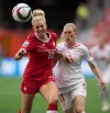 Lauren Sesselmann has shown resilience in her return from an injury to make the Women's World Cup. Sesselmann, left, and Switzerland's Lara Dickenmann vie for the ball during the second half of the FIFA Women's World Cup round of 16 soccer action in Vancouver, B.C., on Sunday, June 21, 2015. THE CANADIAN PRESS/Darryl Dyck