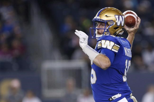 JOHN WOODS / THE CANADIAN PRESS FILES
Winnipeg Blue Bombers quarterback Matt Nichols (15) looks for his receivers during the first half of CFL action against the Hamilton Tiger-Cats in Winnipeg Friday, October 6, 2017. Blue Bombers injured quarterback Matt Nichols says he never doubted he'd be healthy enough to play against the Edmonton Eskimos, but he's amped up his preparations for Sunday's CFL West Division semifinal at home in Winnipeg.