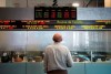 Canada's main stock market is expected to recover in 2019 from its worst performance in a decade that saw the exchange lose 15 per cent amid extreme volatility, plunging oil prices and geopolitical uncertainty, say markets experts. A man watches the financial numbers at the TMX Group in Toronto's financial district on May 9, 2014. THE CANADIAN PRESS/Darren Calabrese