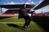 Canada men's national soccer team newly-announced coach John Herdman poses for a picture at BMO Field in Toronto, Monday, Feb. 26, 2018. Herdman, the Canadian men's national team coach, remains optimistic about his team's future despite a shocking exit from the Gold Cup. THE CANADIAN PRESS/Mark Blinch