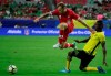 Canada's Scott Arfield (8) jumps over Jamaica's Cory Burke's tackle during a CONCACAF Gold Cup quarterfinal soccer match in Glendale, Ariz., on July 20, 2017. At 30, Scott Arfield is one of the greybeards on the Canadian men's soccer roster. And with more than 400 games under his belt with Falkirk, Huddersfield Town, Burnley and Glasgow Rangers, Arfield has been around the soccer block. Ask him about the young talent now wearing Canada colours and he smiles. They’re fearless, he adds. THE CANADIAN PRESS/AP - Matt York