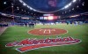 Teams stand on the base lines during the national anthem prior to a pre-season game between the Toronto Blue Jays and the New York Mets Friday, March 28, 2014 in Montreal. The Toronto Blue Jays will return to Montreal to play two pre-season games for the seventh consecutive season next year. THE CANADIAN PRESS/Paul Chiasson