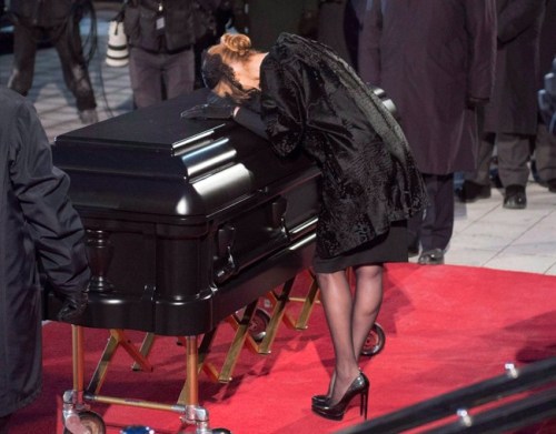 Celine Dion kisses the casket after funeral services for her late husband Rene Angelil at Notre-Dame Basilica Friday, January 22, 2016 in Montreal. The Quebec government says it will contribute $49,770 to the reported cost of Angelil's funeral in Montreal last January. THE CANADIAN PRESS/Ryan Remiorz