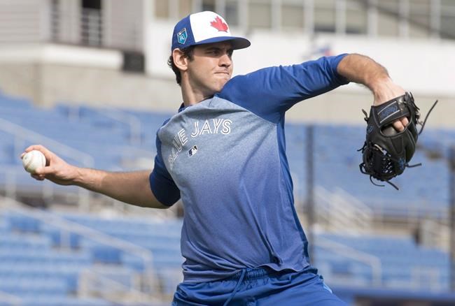 Toronto Blue pitcher Jordan Romano of Markham, Ontario throws long toss prior to the official start of Spring Training in Dunedin, Florida on Monday February 12, 2018. Canadian reliever Jordan Romano is going back to triple-A. The Toronto Blue Jays optioned the Markham, Ont., native to Buffalo Sunday while recalling right-hander Sean Reid-Foley from the triple-A team. The move was announced before Toronto capped a three-game road series against the Boston Red Sox. THE CANADIAN PRESS/Frank Gunn