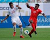 Canada's Jonathan David (20) battles Cuba's Aricheell Hernandez (10) during the first half of their CONCACAF Golf Cup soccer match in Charlotte, N.C., Sunday, June 23, 2019. Teenager David has started this season as he finished the last - by scoring goals. The Ottawa-raised forward struck twice last weekend for Belgium's KAA Gent and looks to add to his national team total Saturday when Canada hosts Cuba in CONCACAF Nations League play. THE CANADIAN PRESS/AP/Chuck Burton