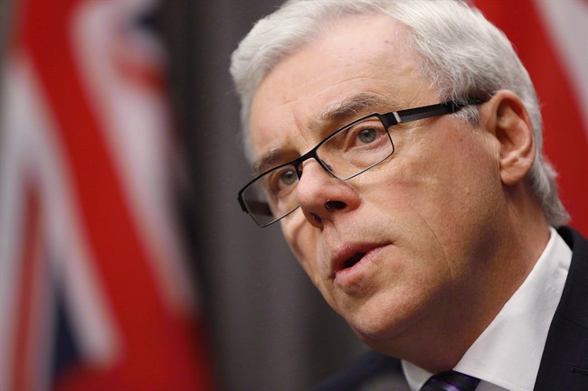 Manitoba Premier Greg Selinger reads his government's speech from the throne at a news conference in Winnipeg on November 20, 2014. If Selinger is worried about possibly getting kicked out of the Manitoba premier's office next Sunday, he's showing no signs of it. THE CANADIAN PRESS/John Woods