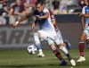 FC Dallas forward Maximiliano Urruti, front, moves the ball past Colorado Rapids midfielder Cole Bassett in the first half of an MLS soccer match Sunday, Oct. 28, 2018, in Commerce City, Colo. The Montreal Impact have signed Argentine striker Maximiliano Urruti to a new three-year contract, with an option year for 2022. THE CANADIAN PRESS/AP/David Zalubowski