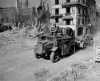Canadian Army personnel ride through town after its capture from the Germans during the Second World War in Falaise, France, on August 17,1944. THE CANADIAN PRESS/National Archives of Canada, Ken Bell - PA-169282