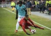 Toronto FC defender Justin Morrow (2) is tripped up by Club Atletico Independiente forward Omar Browne (99) during first half CONCACAF Champions League soccer action in Toronto on Tuesday, February 26, 2019. The Montreal Impact have acquired Panama international midfielder Browne on a loan agreement. THE CANADIAN PRESS/Nathan Denette